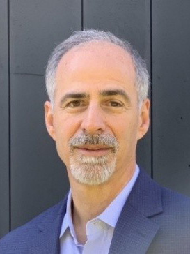 Joe Lupia a man wearing a hat and glasses