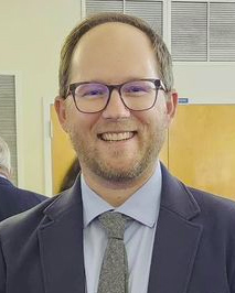 a man wearing a hat and glasses